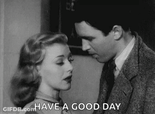 A Black And White Photo Of A Man And Woman Kissing With The Words `` Have A Good Day '' . GIF