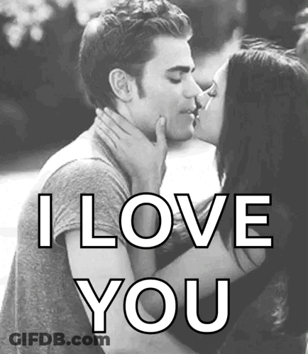 A Black And White Photo Of A Man And Woman Kissing With The Words `` I Love You '' Written Below Them . GIF
