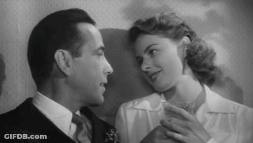 A Black And White Photo Of A Man And Woman GIF