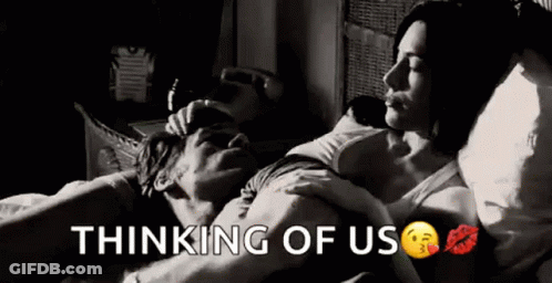 A Black And White Photo Of A Man And Woman Laying In Bed With The Words `` Thinking Of Us '' . GIF
