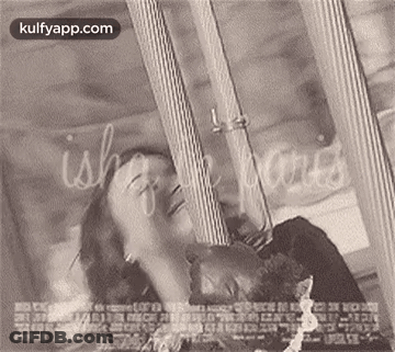 A Black And White Photo Of A Man And Woman Laying Next To Each Other On A Bed . GIF