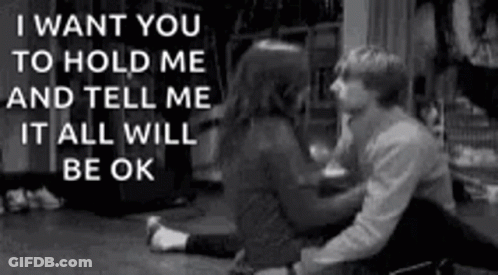 A Black And White Photo Of A Man And Woman Sitting On The Floor With A Quote . GIF