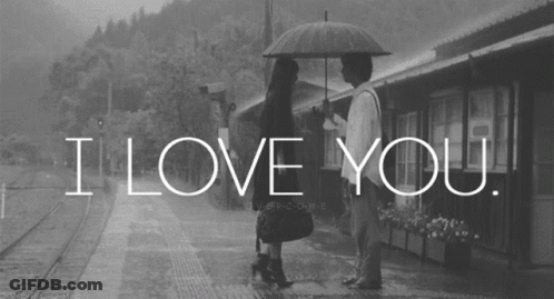 A Black And White Photo Of A Man And Woman Under An Umbrella With The Words I Love You GIF