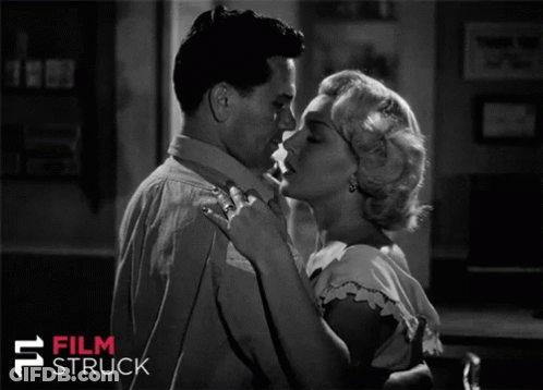 A Black And White Photo Of A Man And Woman With The Words Film Struck On The Bottom Right GIF