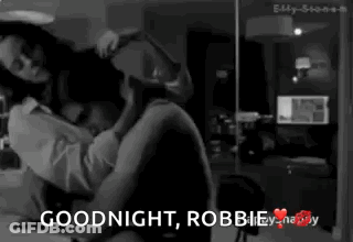 A Black And White Photo Of A Man And Woman With The Words Goodnight Robbie GIF