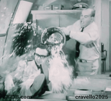 A Black And White Photo Of A Man Being Poured Into Another Man 'S Face And The Year 2025 GIF