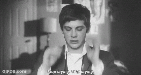 A Black And White Photo Of A Man Crying With The Words `` Stop Crying , Stop Crying . '' GIF