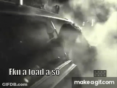 A Black And White Photo Of A Man Driving A Car With Smoke Coming Out Of It . GIF