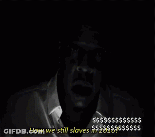 A Black And White Photo Of A Man Holding A Cell Phone In His Hand . GIF