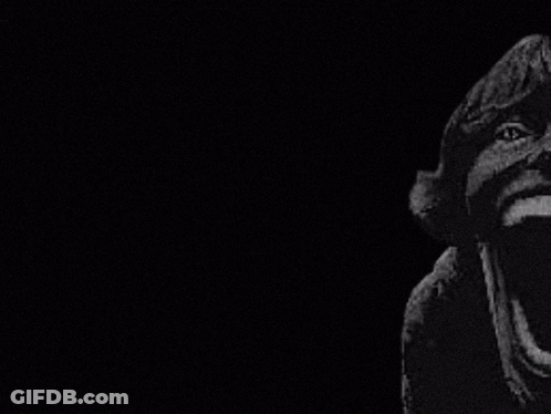 A Black And White Photo Of A Man Holding A Heinz Yellow Mustard Bottle GIF