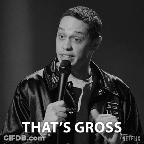 A Black And White Photo Of A Man Holding A Microphone With The Caption That 'S Gross GIF