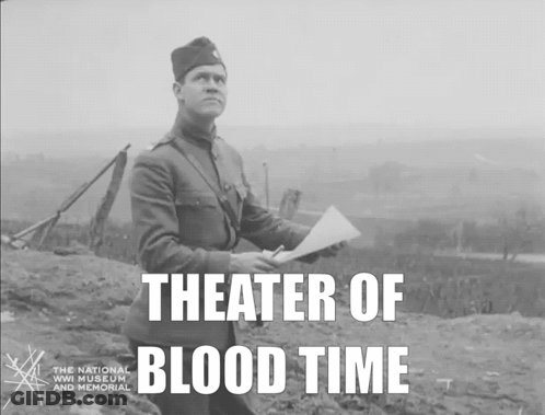 A Black And White Photo Of A Man Holding A Piece Of Paper With The Words Theater Of Blood Time Below Him GIF