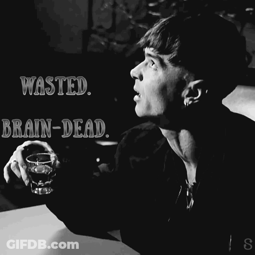 A Black And White Photo Of A Man Holding A Shot Glass And The Words Wasted Brain-Dead GIF