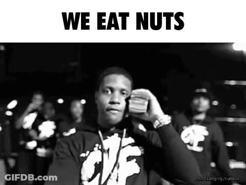A Black And White Photo Of A Man Holding A Stack Of Money With The Words We Eat Nuts Below Him GIF