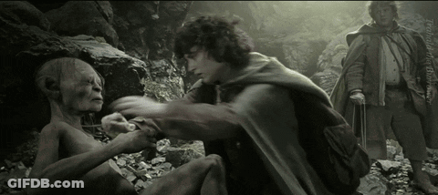 A Black And White Photo Of A Man Holding Another Man 'S Arm GIF