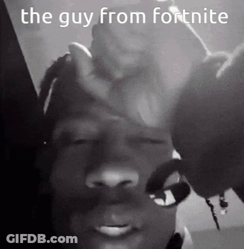A Black And White Photo Of A Man Holding His Hand To His Forehead . GIF