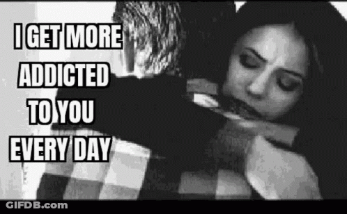 A Black And White Photo Of A Man Hugging A Woman . GIF