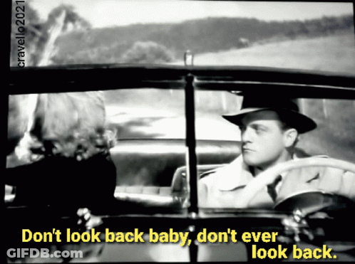 A Black And White Photo Of A Man In A Car With The Caption Do N't Look Back Baby Do N't Ever Look Back. GIF