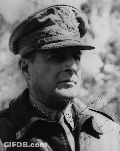 A Black And White Photo Of A Man In A Military Uniform With A Signature On His Jacket That Says " For The Army " GIF