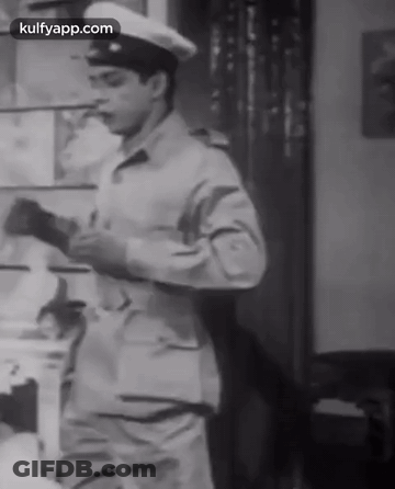 A Black And White Photo Of A Man In A Military Uniform With Kulfyapp.com At The Bottom GIF