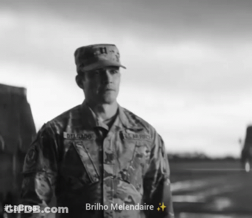 A Black And White Photo Of A Man In A Military Uniform With The Caption Brilho Melendaire GIF
