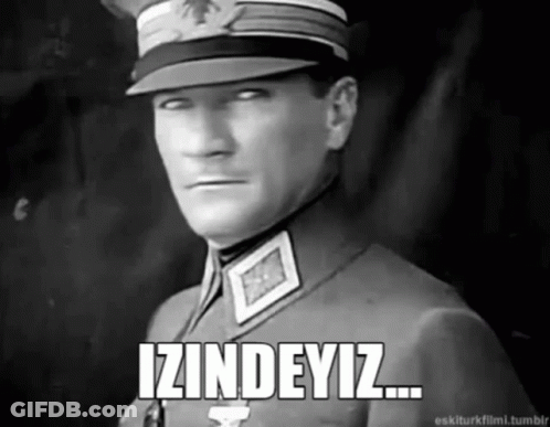 A Black And White Photo Of A Man In A Military Uniform With The Words Izindeyiz Written Below Him GIF