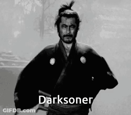 A Black And White Photo Of A Man In A Samurai Costume With The Word Darksoner Written On The Bottom . GIF