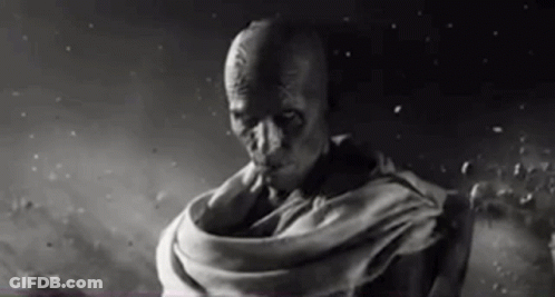 A Black And White Photo Of A Man In A Scarf . GIF