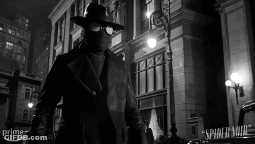 A Black And White Photo Of A Man In A Spider Noir Suit GIF