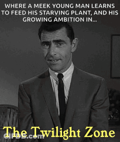 A Black And White Photo Of A Man In A Suit And Tie With A Caption That Says The Twilight Zone GIF
