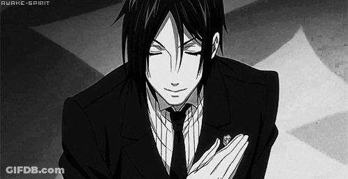 A Black And White Photo Of A Man In A Suit And Tie With His Eyes Closed GIF
