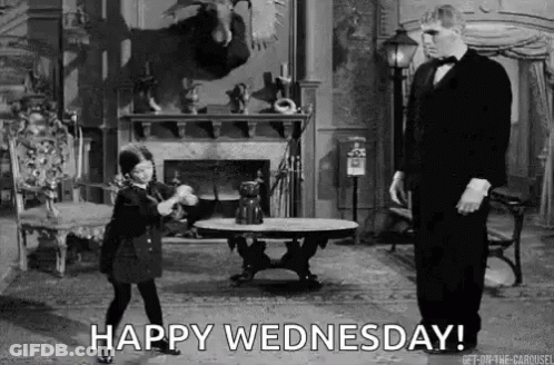 A Black And White Photo Of A Man In A Tuxedo And A Little Girl Dancing In A Living Room . GIF