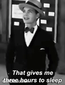 A Black And White Photo Of A Man In A Tuxedo And Hat That Says That Gives Me Three Hours To Sleep GIF
