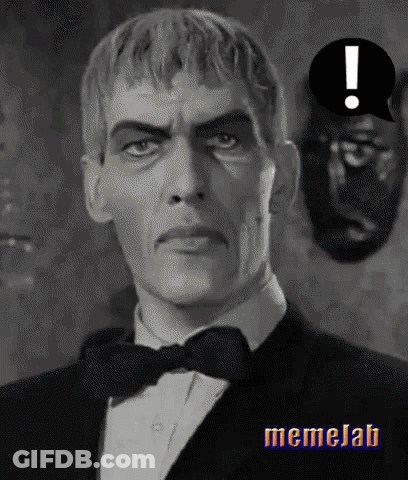 A Black And White Photo Of A Man In A Tuxedo With An Exclamation Point Above Him . GIF