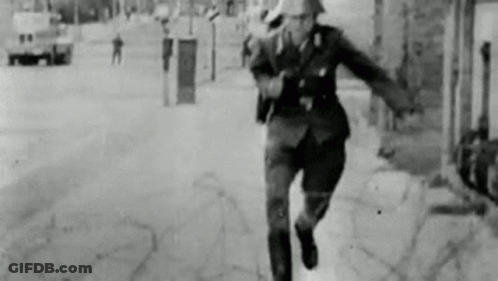 Black And White Photo Of Man Running In Uniform GIF