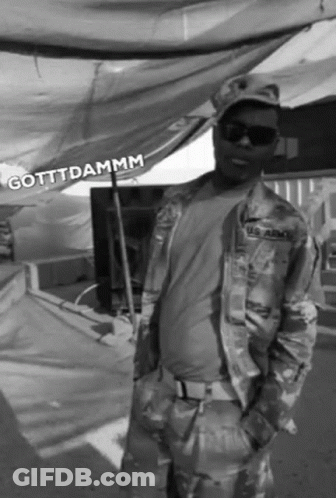 A Black And White Photo Of A Man In A Us Army Uniform GIF