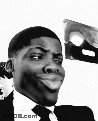 A Black And White Photo Of A Man Making A Funny Face GIF