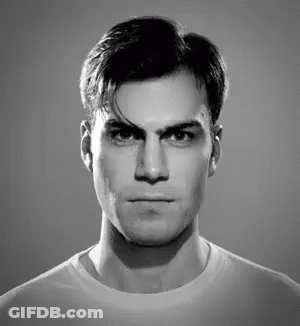 A Black And White Photo Of A Man Making A Funny Face GIF