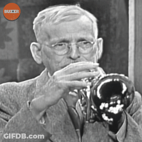 A Black And White Photo Of A Man Playing A Trumpet With A Buzzr Logo Above Him GIF