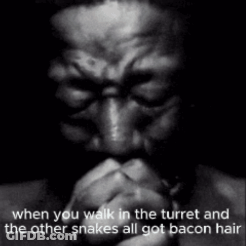 A Black And White Photo Of A Man Praying With The Caption " When You Walk In The Turret And The Other Snakes All Got Bac GIF
