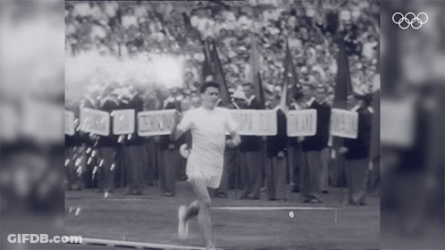 A Black And White Photo Of A Man Running With A Sign That Says ' Freedom ' On It GIF