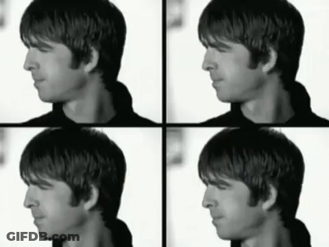 A Black And White Photo Of A Man 'S Face And Neck GIF