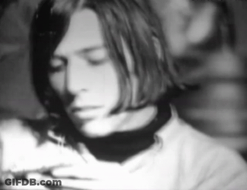 A Black And White Photo Of A Man 'S Face GIF