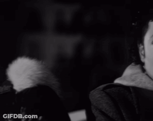A Black And White Photo Of A Man 'S Face With A Serious Look On His Face GIF