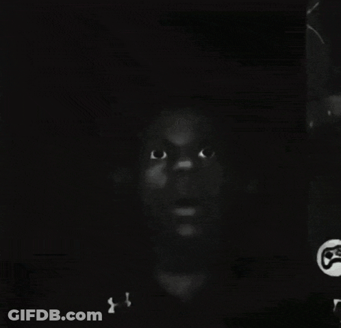 A Black And White Photo Of A Man 'S Face With A Under Armour Shirt On GIF