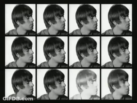 A Black And White Photo Of A Man 'S Face With Different Shades Of Hair GIF