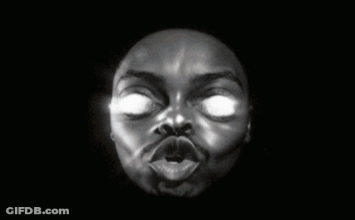 A Black And White Photo Of A Man 'S Face With Glowing Eyes GIF