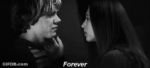 A Black And White Photo Of A Man 'S Face With The Words `` Forever '' Written Above Him . GIF