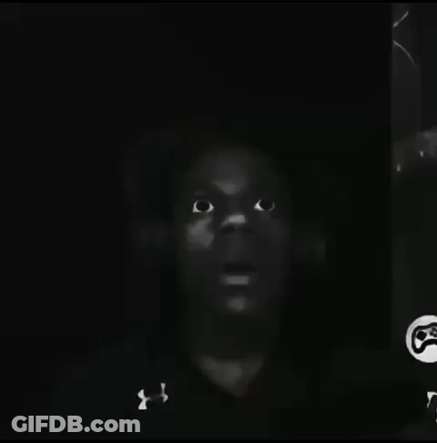 A Black And White Photo Of A Man 'S Face With Under Armour On His Shirt GIF