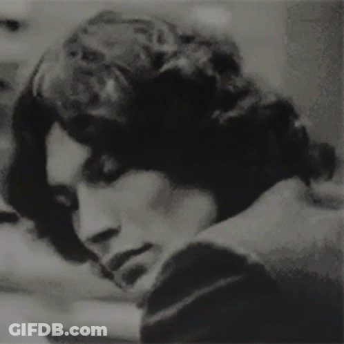 A Black And White Photo Of A Man 'S Face GIF
